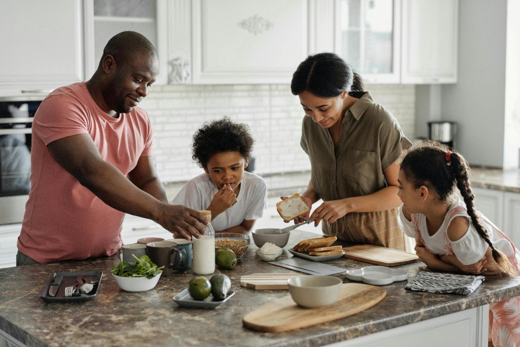 Family enjoying a healthy breakfast together &mdash; making healthy life within reach