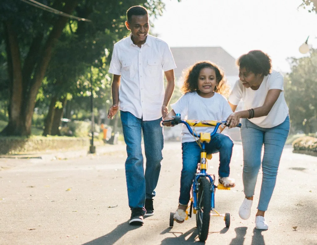 Family enjoying an active healthy life outdoors - healthy life for everyone